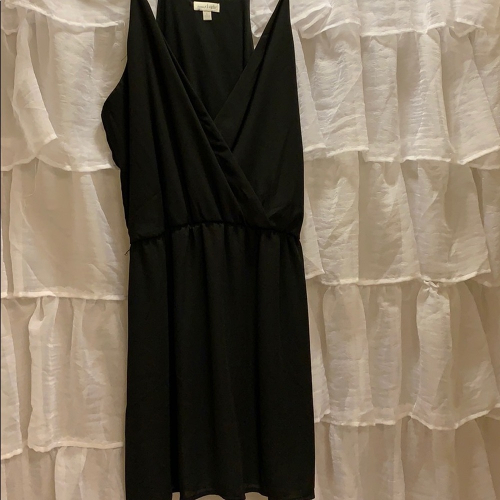 Black spaghetti strapped Charming Charlie dress.